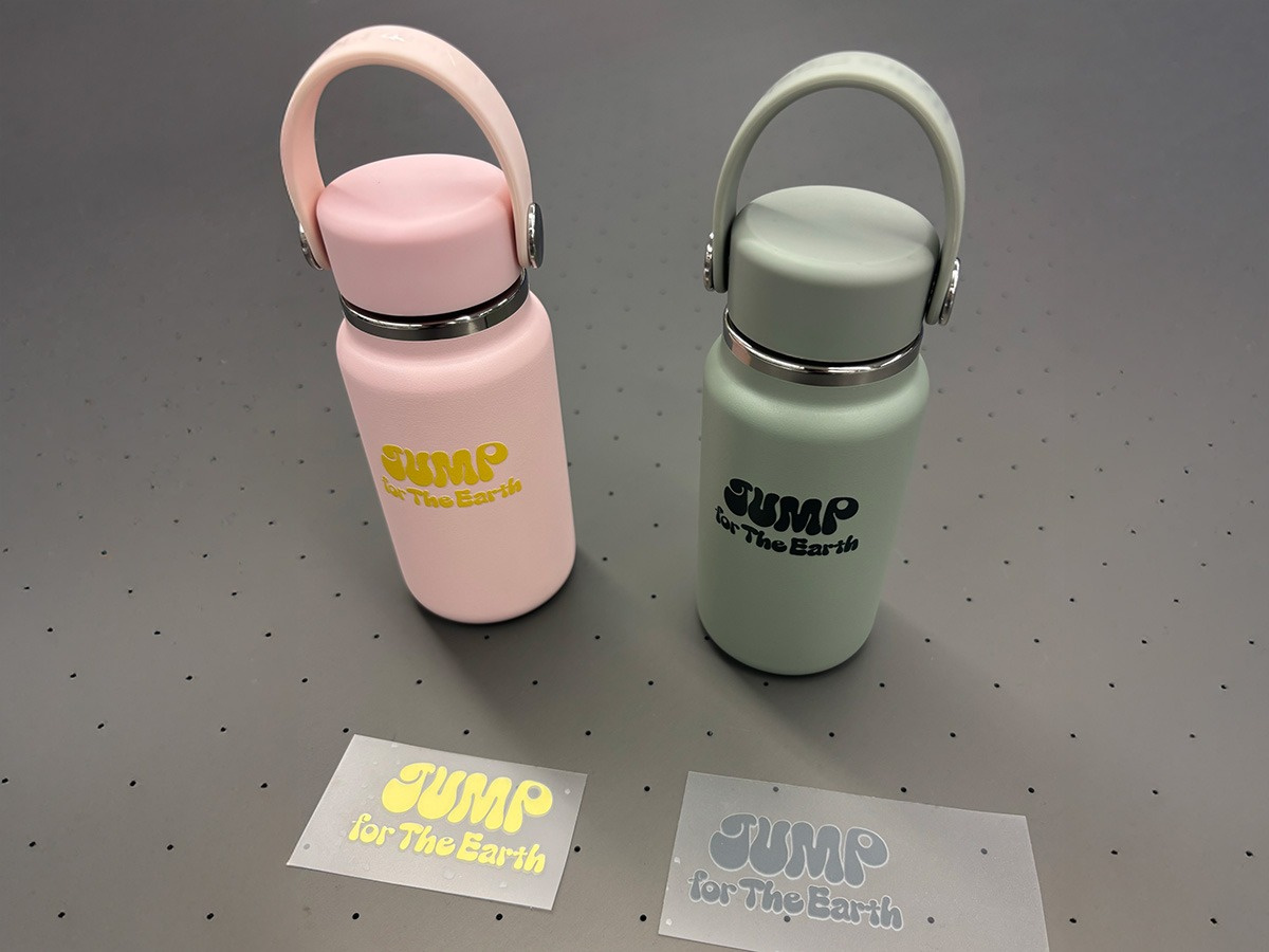 An original tumbler printed with the logo of "JUMP for the Earth PROJECT" on a UV-DTF printer
